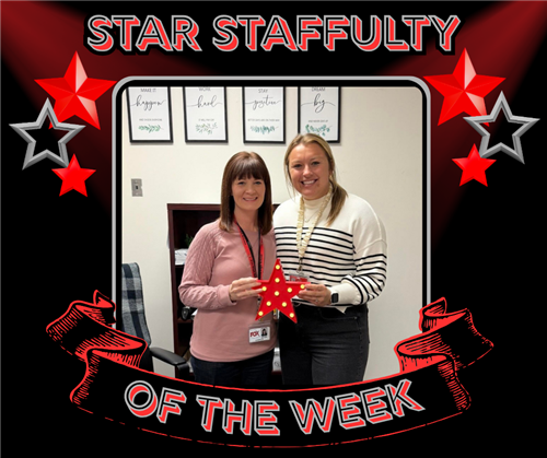 Two nice ladies posing with the red star award.